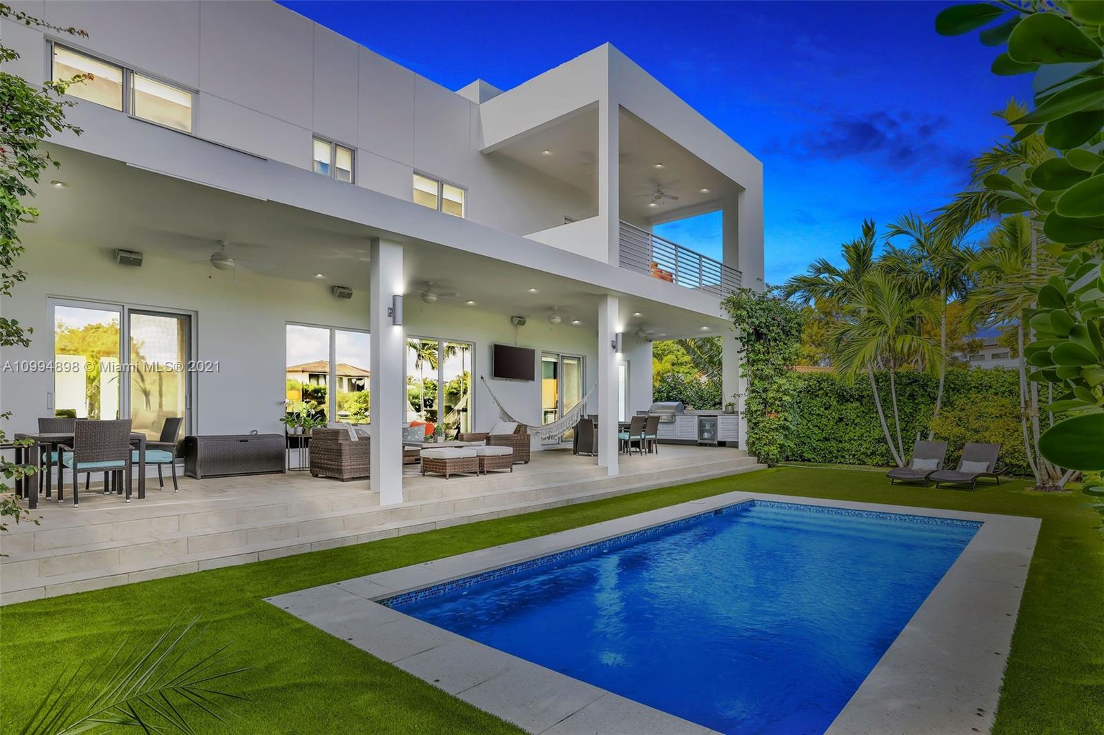 12565 Palm Road North Miami, FL 33181 - Photo 73 of 75 a view of a backyard with swimming pool and sitting area