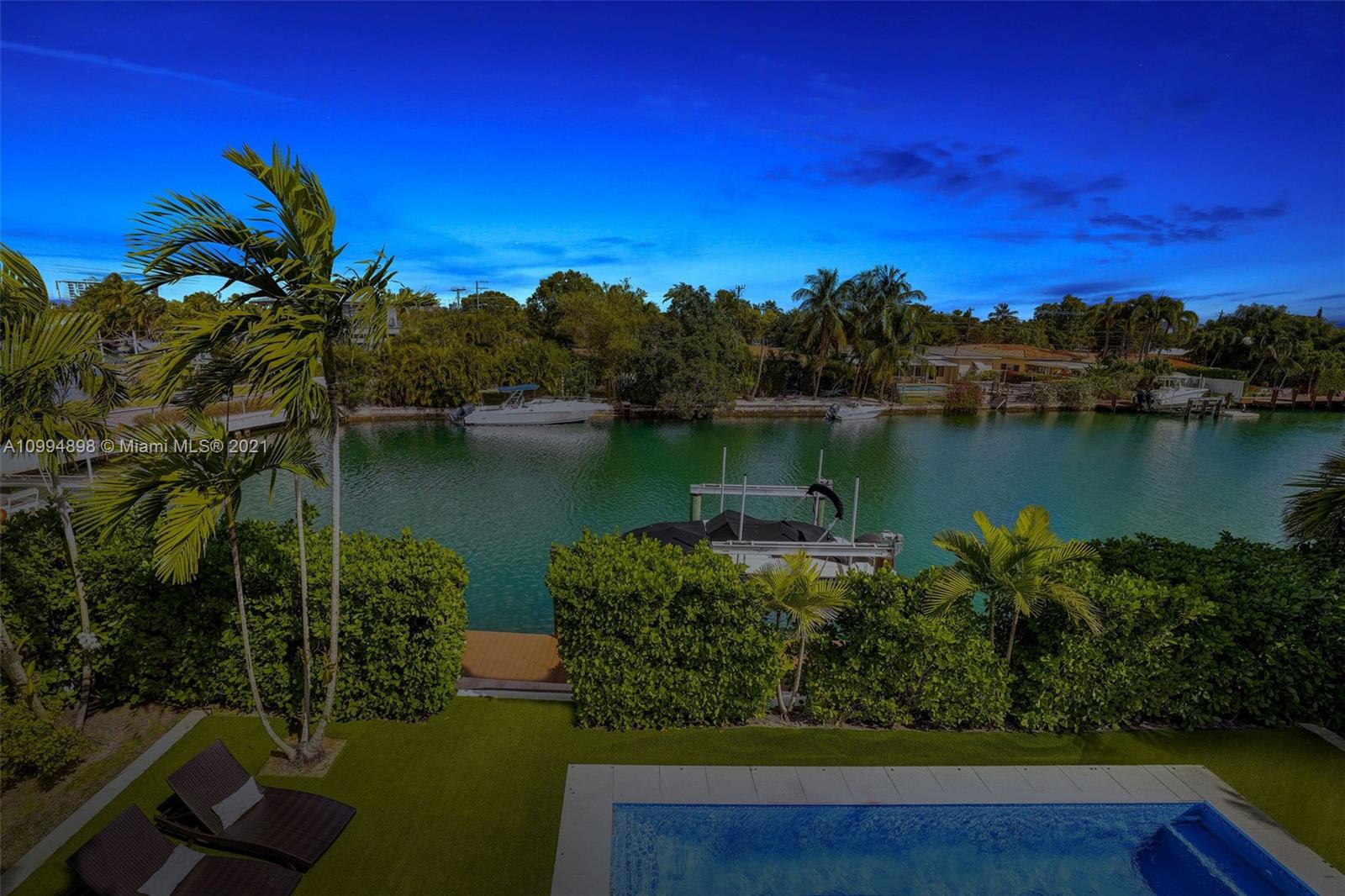 12565 Palm Road North Miami, FL 33181 - Photo 75 of 75 a view of a lake with a garden