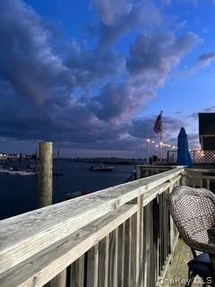 12-14 West 5th Road Queens, NY 11693 - Photo 40 of 43 Balcony at dusk with a water view