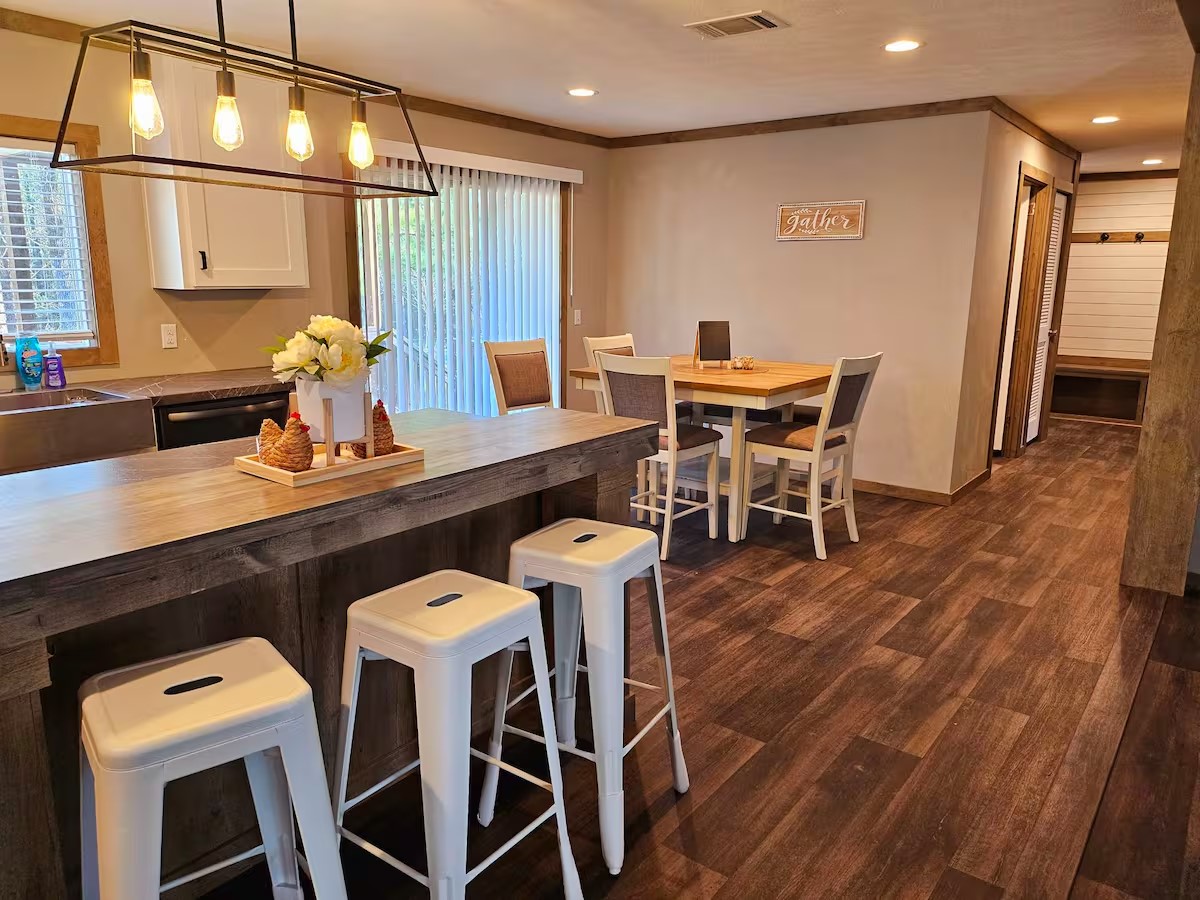 105 Saddle Surrey Road Coldspring, TX 77331 - Photo 22 of 48 a dining room with furniture and wooden floor
