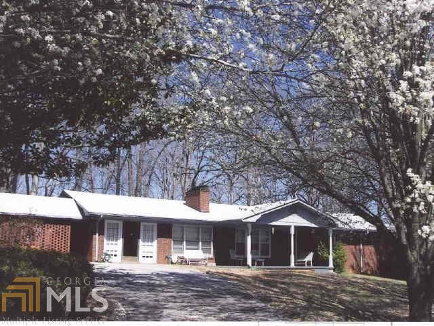 1321 Alec Mountain Road Clarkesville, GA 30523 - Photo 1 of 1 a front view of a house with a yard