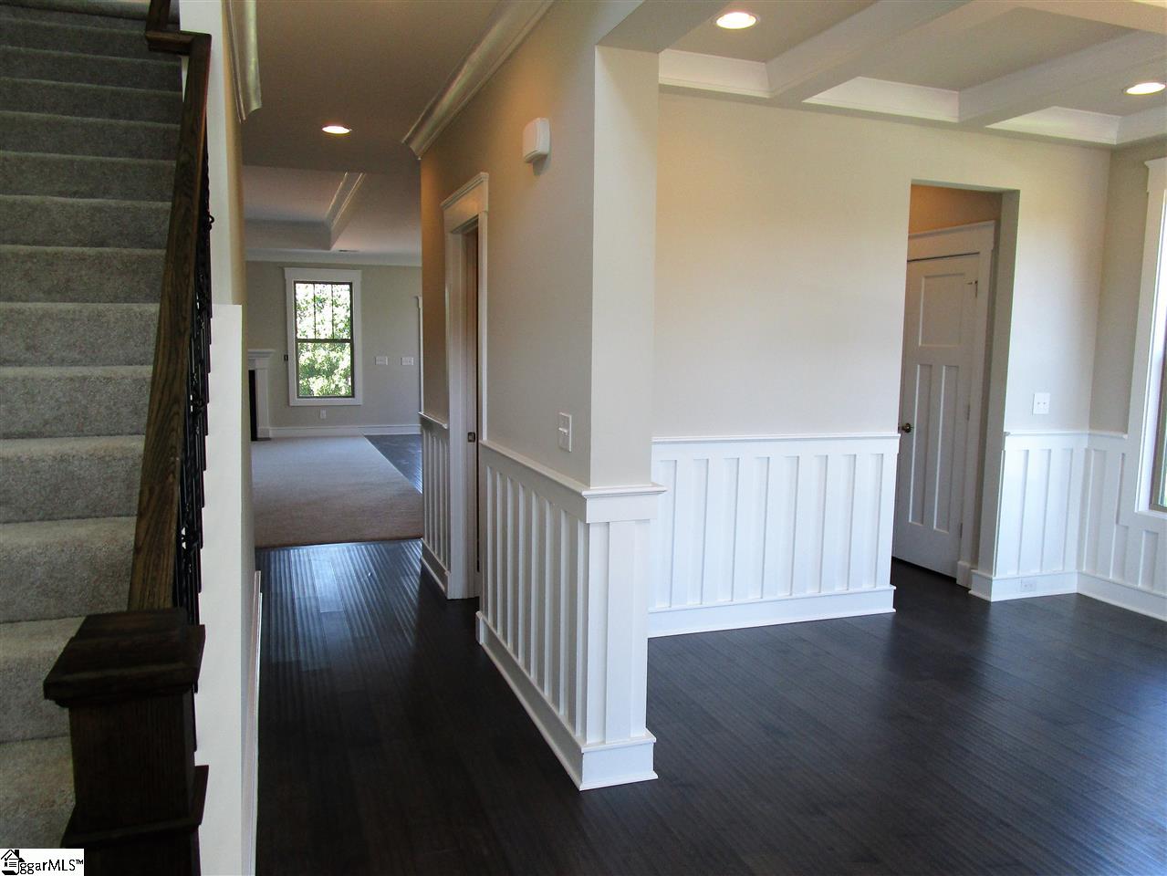 4 Longfellow Way Simpsonville, SC 29681 - Photo 4 of 36 Hardwood floors and a wrought iron staircase welcome you into this craftsman gem