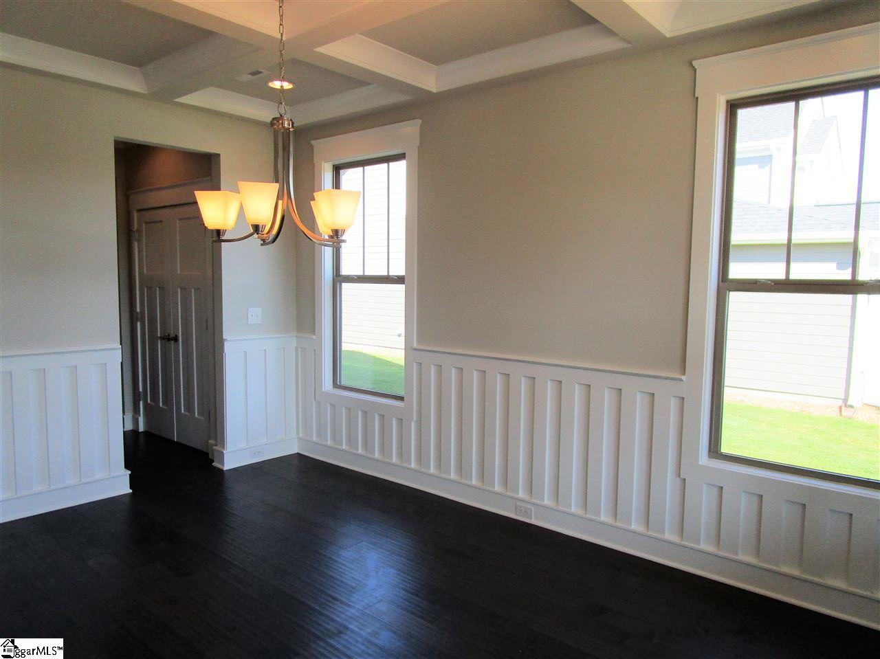 4 Longfellow Way Simpsonville, SC 29681 - Photo 7 of 36 Wainscotting and a coffered ceiling add luxury and sophistication to your formal dining room