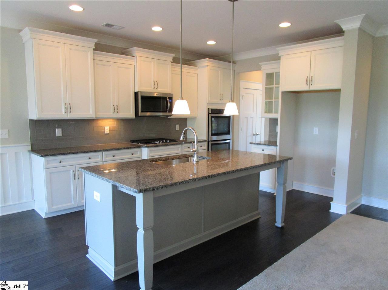 4 Longfellow Way Simpsonville, SC 29681 - Photo 9 of 36 Gather around this oversized island that's perfect for entertaining