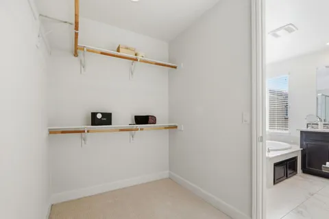 a view of storage and utility room with washer and dryer