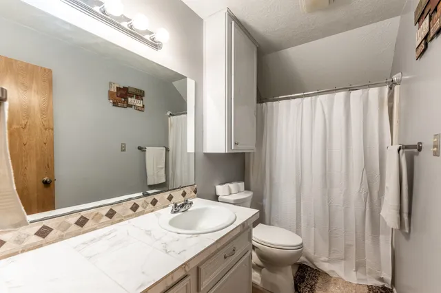 a bathroom with a sink and a toilet