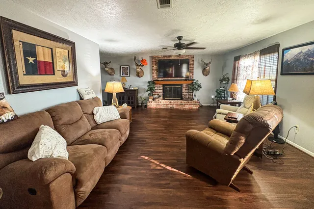 a living room with furniture or couch and a bookshelf