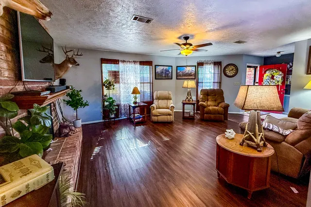 a kitchen with stainless steel appliances granite countertop a sink and a refrigerator