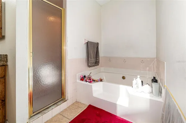 a bathroom with a bathtub and a sink