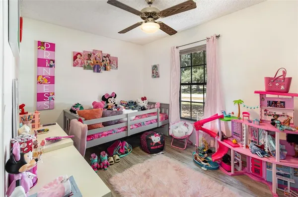 a bed room with a bed and a baby crib