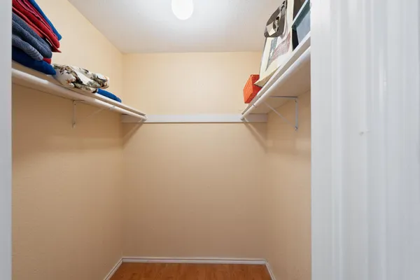 a living room with furniture and a ceiling fan