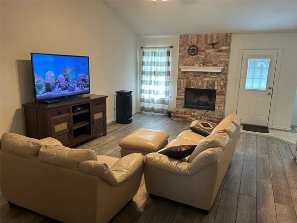 a view of a kitchen with an empty space and a window