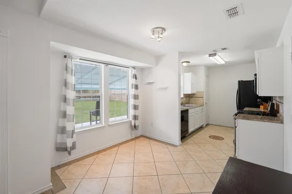a kitchen with a stove microwave and refrigerator