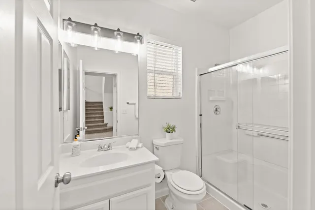 a bedroom with a bed and a chair