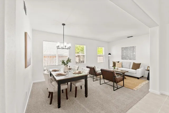 a view of a dining room with furniture window and outside view
