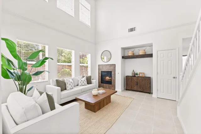 a kitchen with cabinets appliances a sink and a window