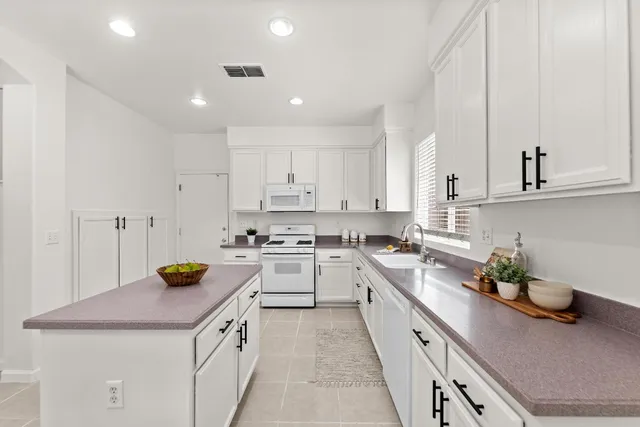 a view of a dining room with furniture and window