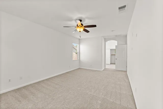 a view of a hallway with white walls