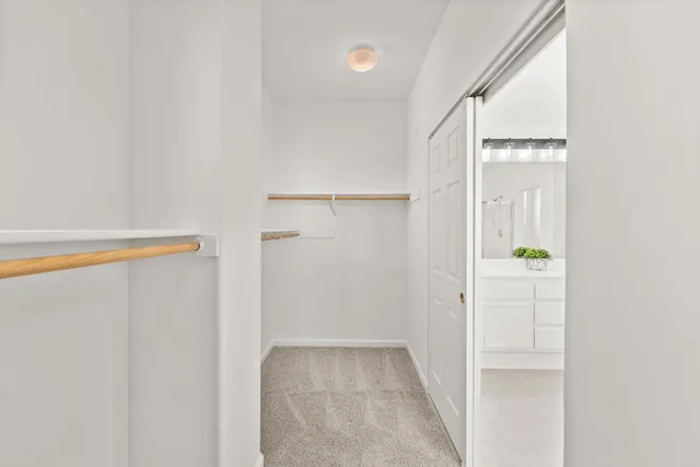 a bathroom with a sink a toilet and shower curtain