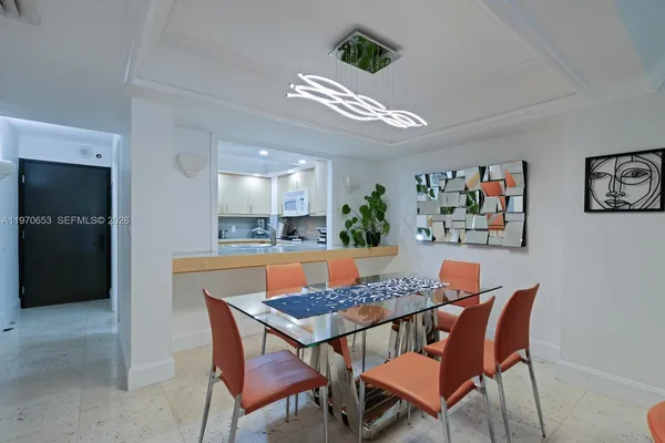a kitchen with stainless steel appliances a sink a stove and a cabinets