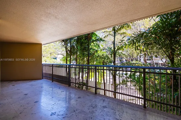 a lobby with furniture and a projector screen