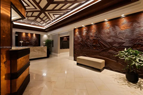 a living room with furniture and a ceiling fan