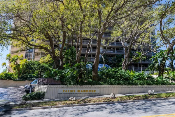 a kitchen with a sink dishwasher and cabinets