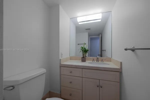 a bedroom with a bed and a cabinets