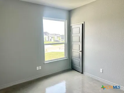 an empty room with windows