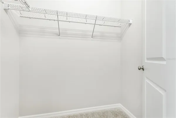 a bathroom with a granite countertop sink a toilet and bathtub