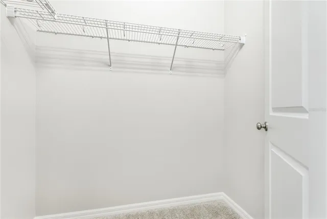 a bathroom with a granite countertop sink a toilet and bathtub
