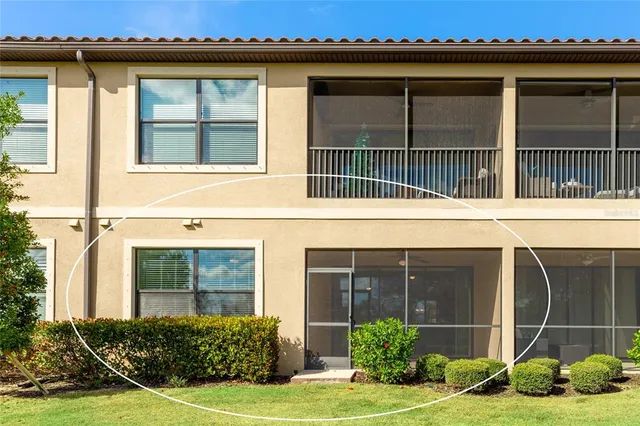 a view of a house with a window and garden