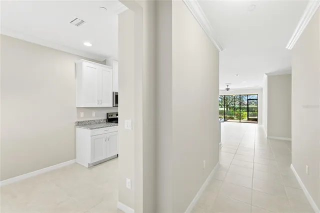 a kitchen with a refrigerator and a sink