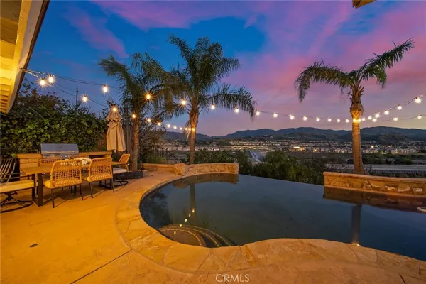 a view of a patio with swimming pool