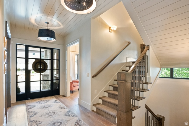 3 Carriagewood Cove, Unit 1088 Sandy, UT 84092 - Photo 14 of 79 Entryway featuring a large grid-pattern glass door, wood-finish flooring, and shiplap ceiling
