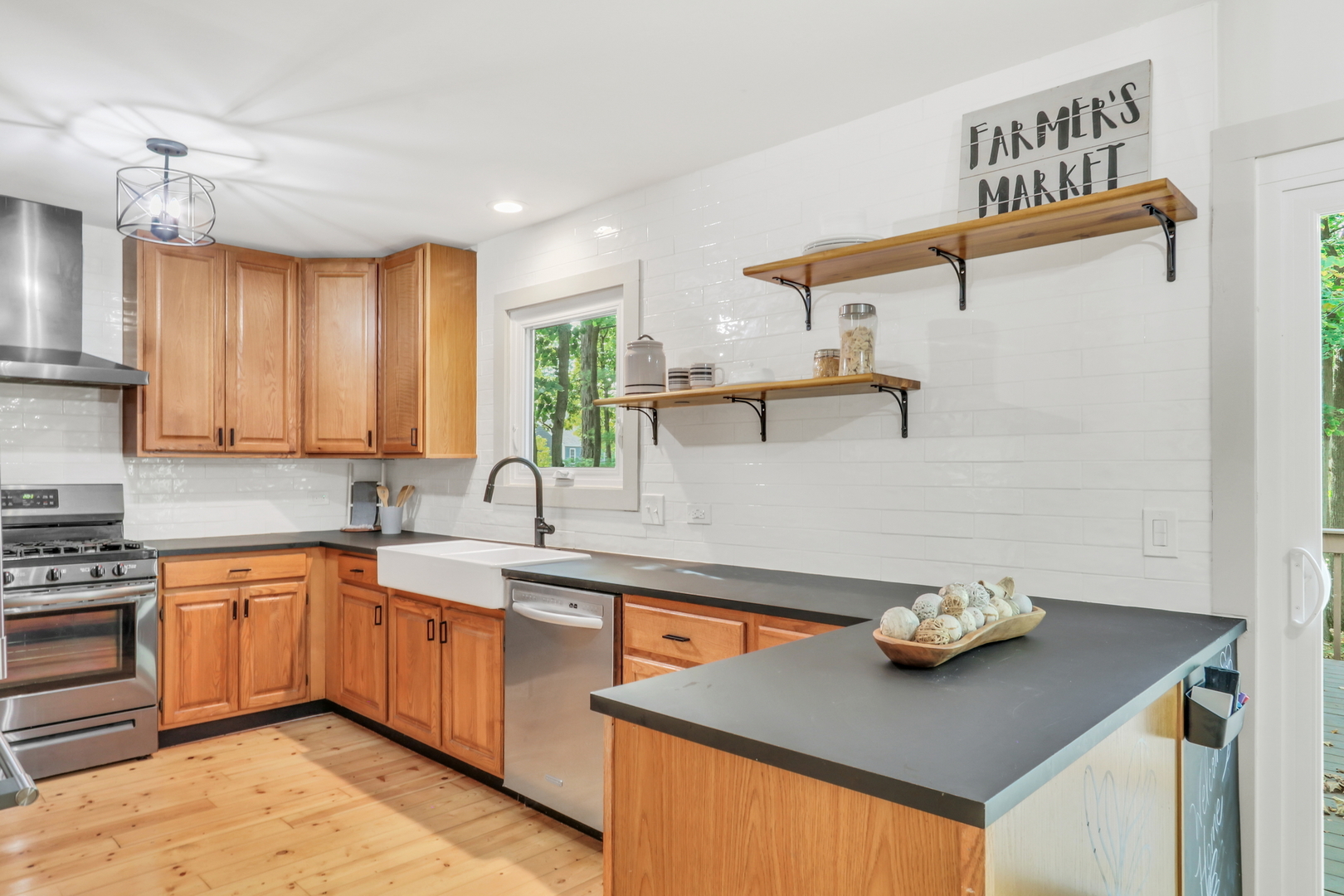 334 Concord Square Gurnee, IL 60031 - Photo 16 of 43 a kitchen with a sink a stove and cabinets