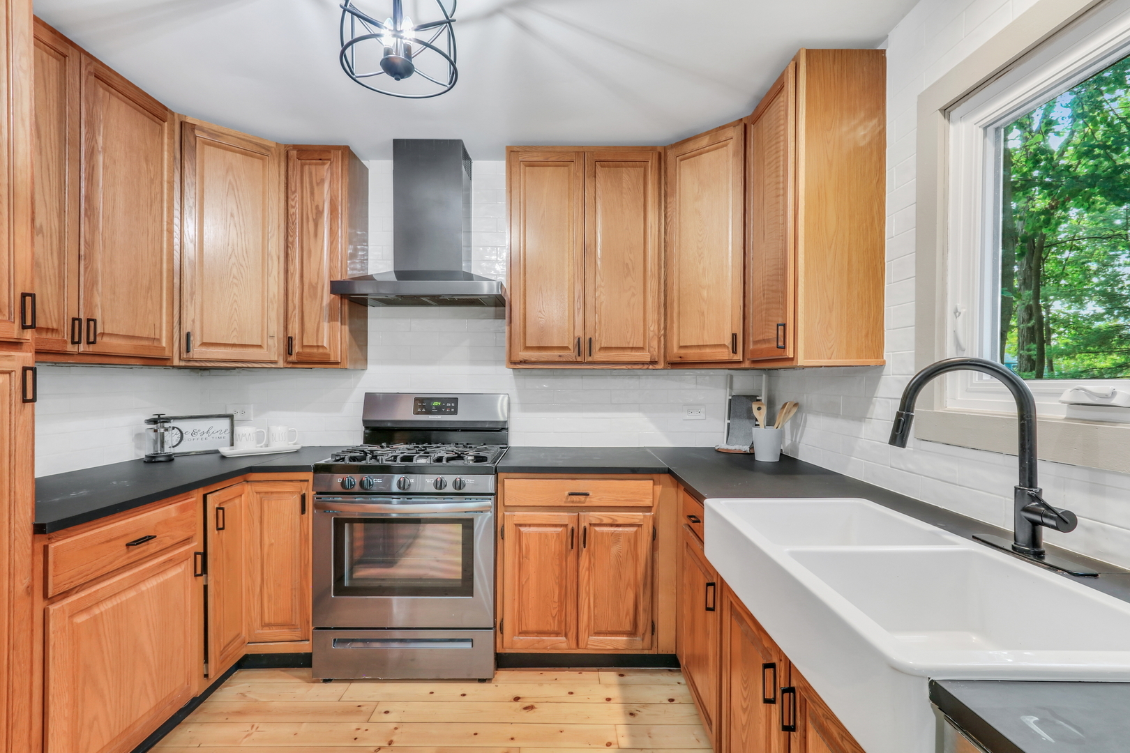 334 Concord Square Gurnee, IL 60031 - Photo 17 of 43 a kitchen with stainless steel appliances granite countertop a sink a stove and cabinets