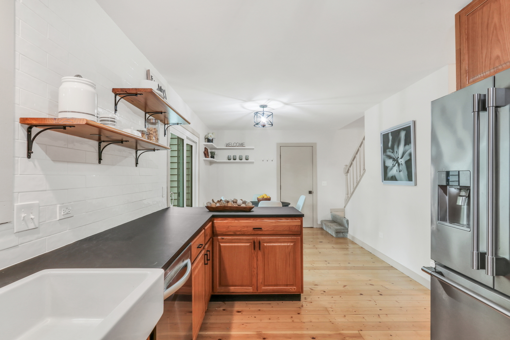 334 Concord Square Gurnee, IL 60031 - Photo 18 of 43 a kitchen with stainless steel appliances granite countertop a sink and a refrigerator