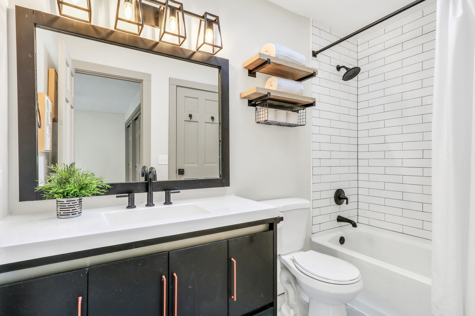 334 Concord Square Gurnee, IL 60031 - Photo 26 of 43 a bathroom with a sink a toilet a mirror a vanity and shower