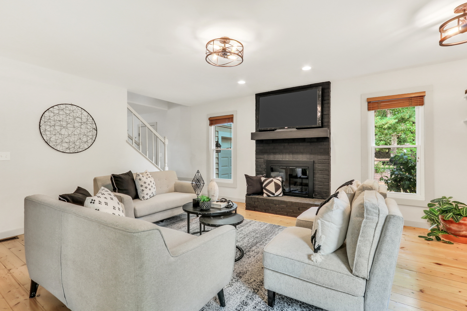 334 Concord Square Gurnee, IL 60031 - Photo 7 of 43 a living room with furniture a fireplace and a flat screen tv