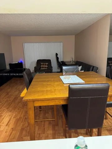 a kitchen with stainless steel appliances granite countertop a sink and a stove