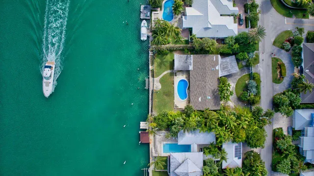 an aerial view of a house with a yard basket ball court and outdoor seating