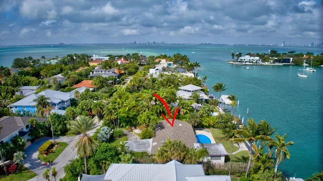 an aerial view of residential house with outdoor space and lake view