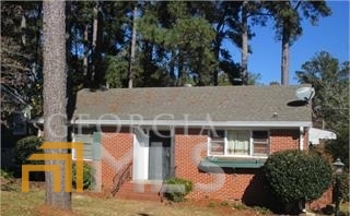 1681 Upper River Road Macon, GA 31211 - Photo 1 of 1 a view of house with outdoor space and tall windows