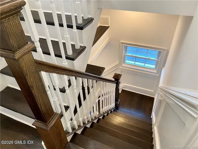 a view of an entryway with wooden floor