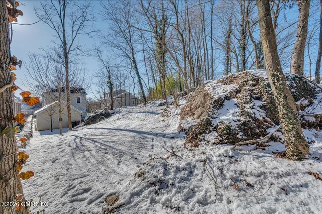a view of a backyard of the house
