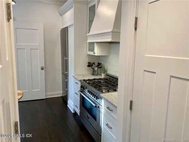 a kitchen with a stove and a refrigerator