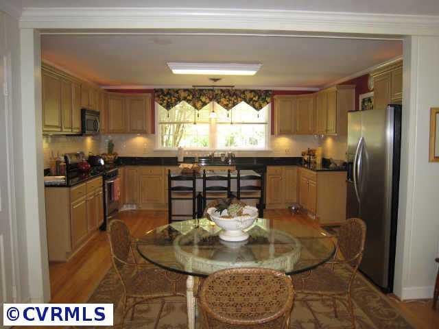 8902 Norwick Road Richmond, VA 23229 - Photo 3 of 10 Other - Sunroom and gathering room open to deck overlooking the treetops