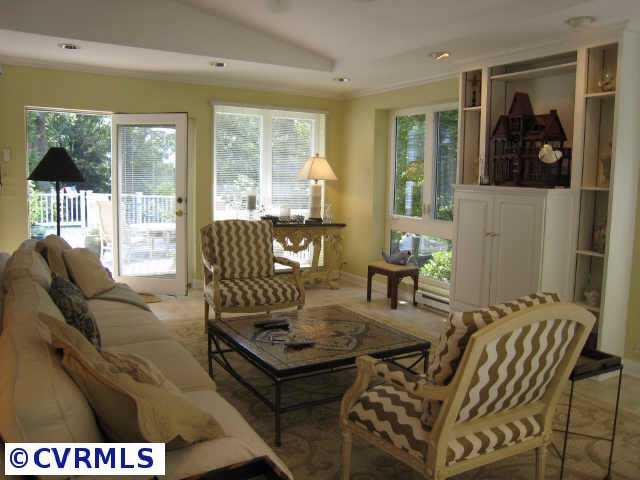 8902 Norwick Road Richmond, VA 23229 - Photo 4 of 10 Other - Formal living room with fireplace opens to sunroom with gorgeous views