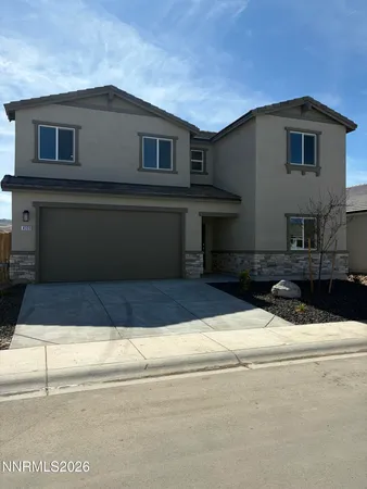 a front view of a house with garage